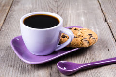 purple-coffee-cup-saucer-spoon-gray-wooden-table-80853020